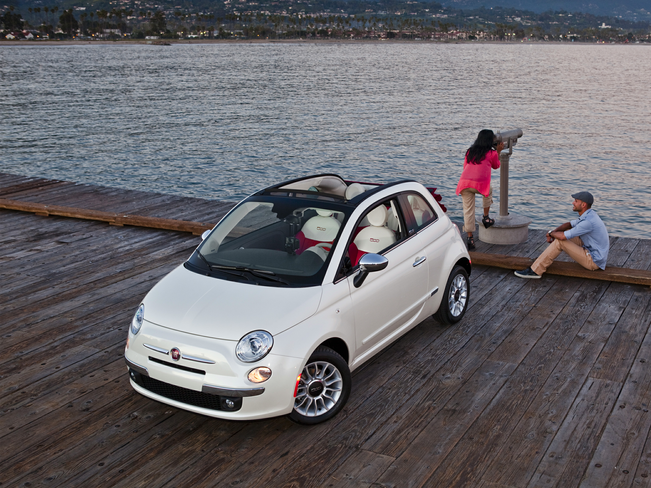 Fiat 500 C is convertible version of the Fiat 500 city car with a a  full-length sunroof. Fiat 500 C interior close up on driver's seat,  steering wheel and gauges. Stock Photo