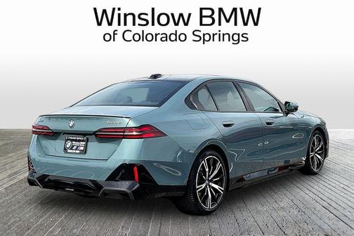 Green Metallic 2025 BMW 550e xDrive