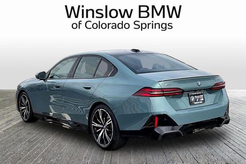 Green Metallic 2025 BMW 550e xDrive