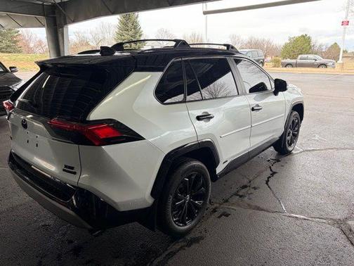 Wind Chill Pearl/Midnight Black Metallic 2024 Toyota RAV4 Hybrid SE