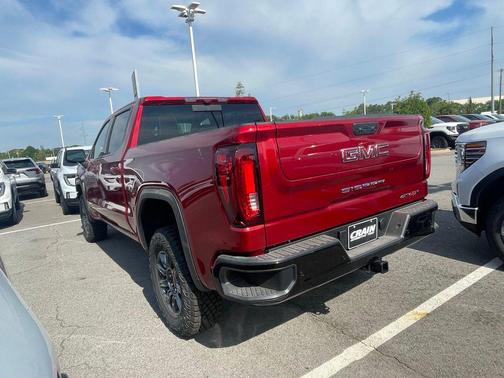 Volcanic Red Tintcoat 2026 GMC Sierra 1500 AT4X