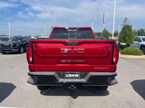 Volcanic Red Tintcoat 2026 GMC Sierra 1500 AT4X