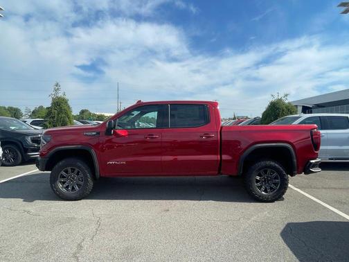 Volcanic Red Tintcoat 2026 GMC Sierra 1500 AT4X