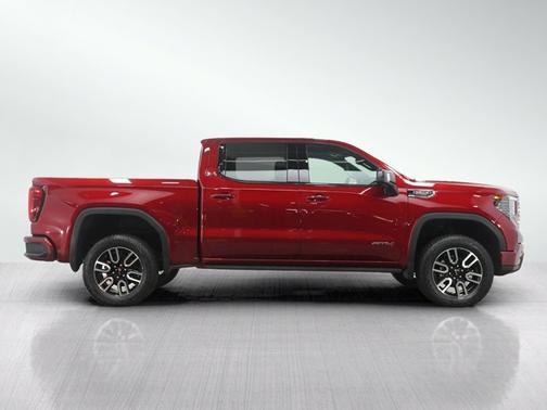 Volcanic Red Tintcoat 2025 GMC Sierra 1500 AT4