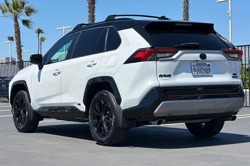 Wind Chill Pearl/Midnight Black Metallic 2024 Toyota RAV4 Hybrid SE