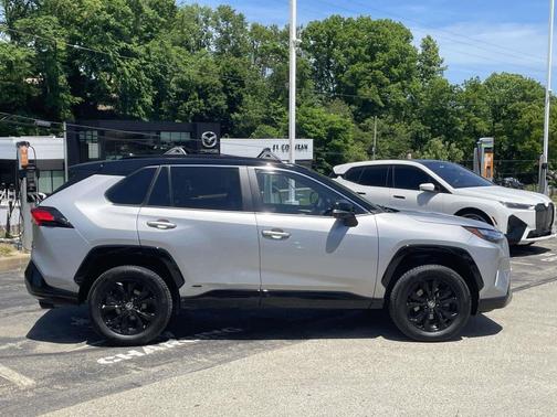 Silver Sky Metallic/Midnight Black Metallic 2024 Toyota RAV4 Hybrid SE