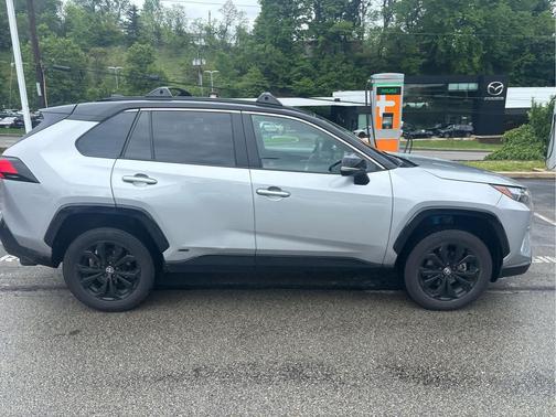 Silver Sky Metallic/Midnight Black Metallic 2024 Toyota RAV4 Hybrid SE