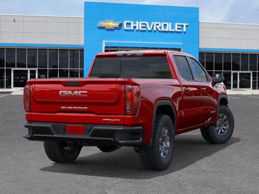 Volcanic Red Tintcoat 2026 GMC Sierra 1500 AT4X