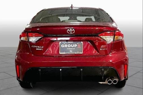 Red 2026 Toyota Corolla Hybrid SE
