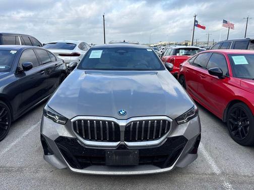 Oxide Grey Metallic 2025 BMW 550e xDrive