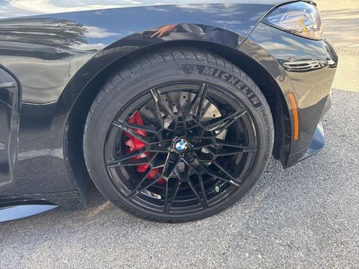 Black Sapphire Metallic 2024 BMW M4 Competition xDrive