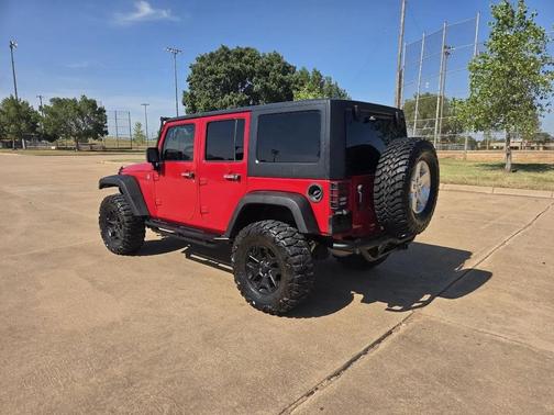 Red 2014 Jeep Wrangler Unlimited Sahara