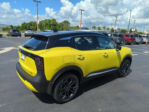 Yellow 2026 Nissan Kicks SR