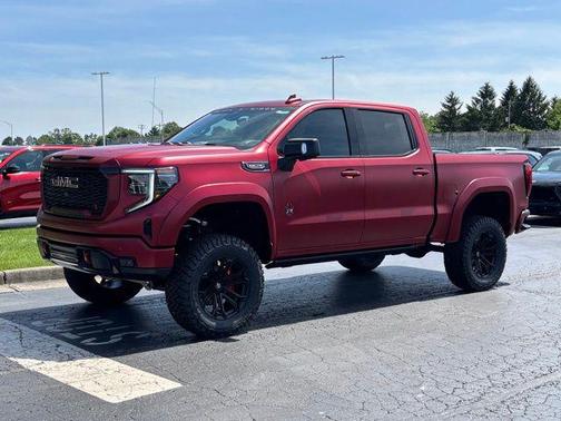 Volcanic Red Tintcoat 2026 GMC Sierra 1500 AT4