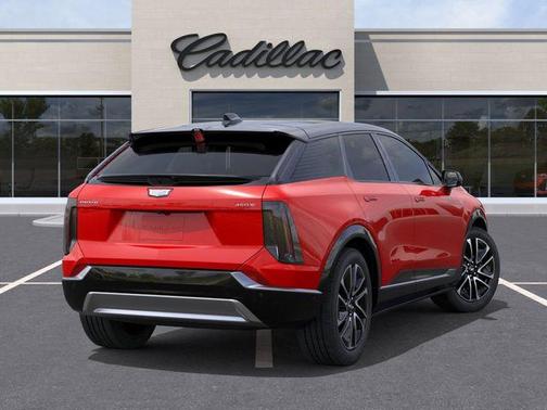 Orange 2026 Cadillac OPTIQ Premium Sport