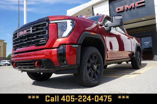 Volcanic Red Tintcoat 2026 GMC Sierra 2500 AT4
