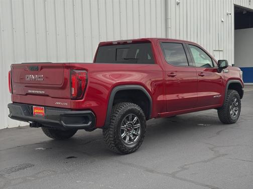 Volcanic Red Tintcoat 2026 GMC Sierra 1500 AT4X