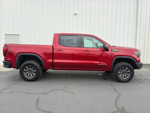 Volcanic Red Tintcoat 2026 GMC Sierra 1500 AT4X