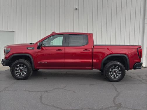 Volcanic Red Tintcoat 2026 GMC Sierra 1500 AT4X