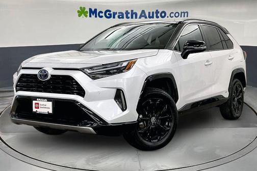 Wind Chill Pearl/Midnight Black Metallic 2023 Toyota RAV4 Hybrid SE