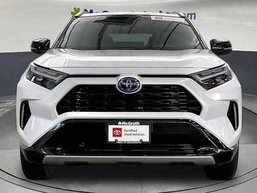 Wind Chill Pearl/Midnight Black Metallic 2023 Toyota RAV4 Hybrid SE