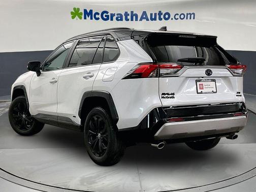Wind Chill Pearl/Midnight Black Metallic 2023 Toyota RAV4 Hybrid SE