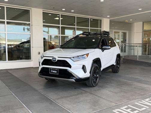 Wind Chill Pearl/Midnight Black Metallic 2023 Toyota RAV4 Hybrid SE