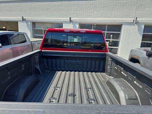 Volcanic Red Tintcoat 2026 GMC Sierra 3500 AT4