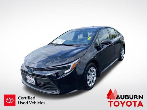 Midnight Black Metallic 2025 Toyota Corolla Hybrid LE