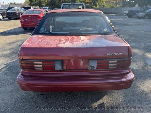 Maroon 1994 Plymouth Sundance 4dr
