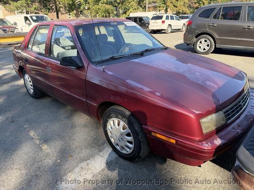 Maroon 1994 Plymouth Sundance 4dr