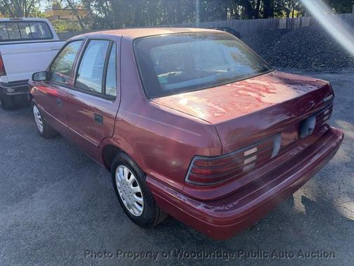 Maroon 1994 Plymouth Sundance 4dr