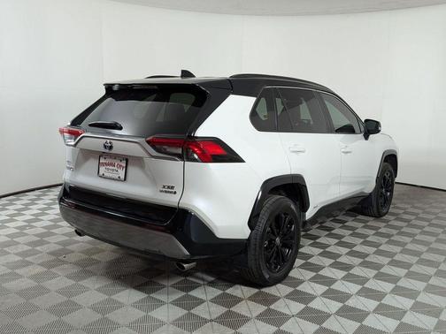 Wind Chill Pearl/Midnight Black Metallic 2024 Toyota RAV4 Hybrid SE