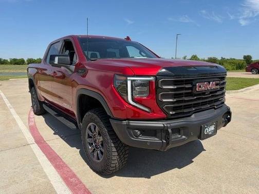 Volcanic Red 2025 GMC Sierra 1500 AT4X