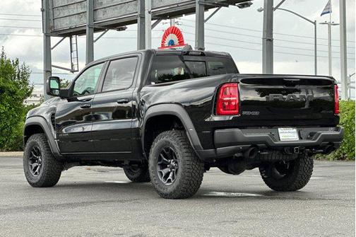 Diamond Black Crystal Pearlcoat 2026 RAM 1500 RHO Crew Cab 4x4 5'7' Box