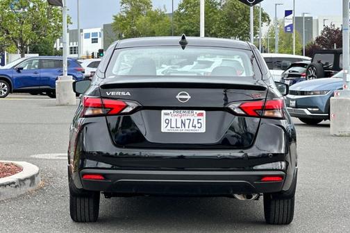 Black 2024 Nissan Versa 1.6 SR
