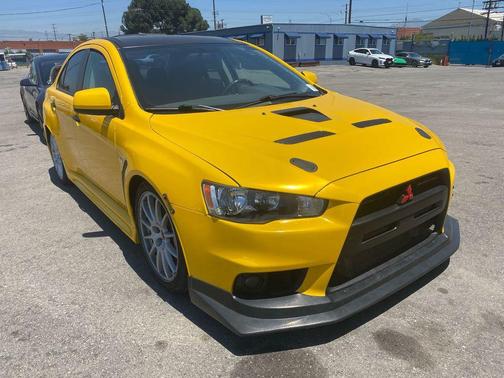 Yellow 2008 Mitsubishi Lancer Evolution GSR