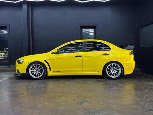 Yellow 2008 Mitsubishi Lancer Evolution GSR
