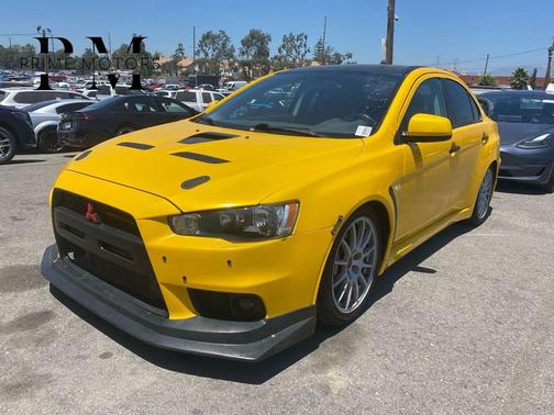 Yellow 2008 Mitsubishi Lancer Evolution GSR