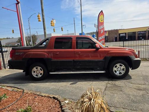Orange 2002 Chevrolet Avalanche 1500