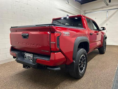 Red 2025 Toyota Tacoma Hybrid TRD