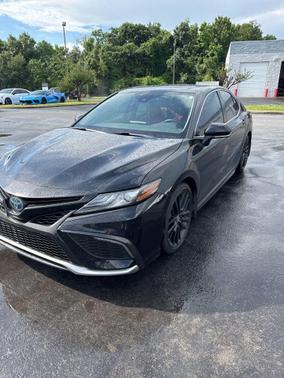 Midnight Black Metallic 2024 Toyota Camry Hybrid SE