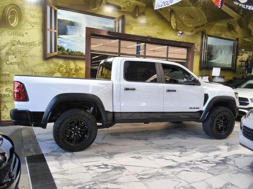 Bright White Clearcoat 2025 RAM 1500 RHO Crew Cab 4x4 5'7' Box