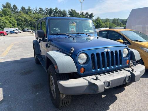 Deep Water Blue Pearlcoat / Black Soft Top 2010 Jeep Wrangler Unlimited Sport
