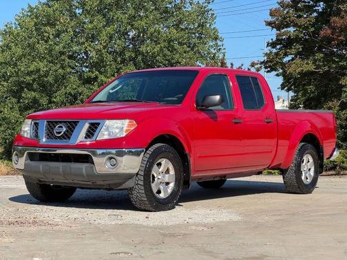 Red 2010 Nissan Frontier SE