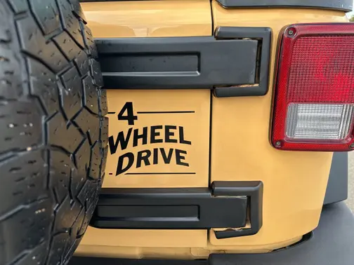 Tan 2013 Jeep Wrangler Unlimited Sport