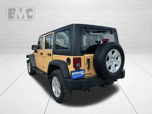 Tan 2013 Jeep Wrangler Unlimited Sport