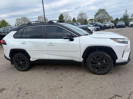 Wind Chill Pearl/Midnight Black Metallic 2023 Toyota RAV4 Hybrid SE