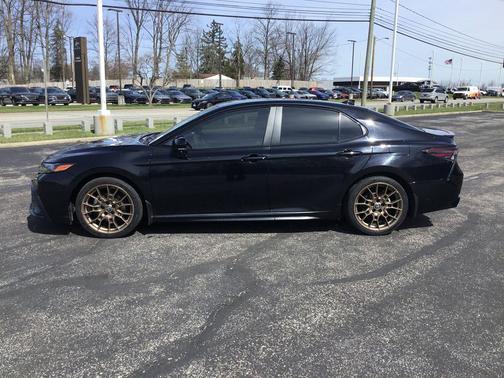 Midnight Black Metallic 2024 Toyota Camry Hybrid SE
