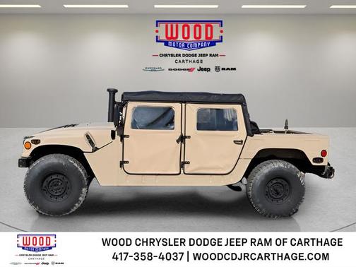 Beige 1999 AM General Hummer